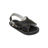 Kid's handmade black genuine leather Mexican sandals featuring a classic two-strap design, adjustable buckle heel strap, cushioned leather footbed, and durable rubber outsole handcrafted in Mexico.