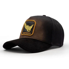 Black western luxury snapback hat featuring gold manta ray emblem and curved brim