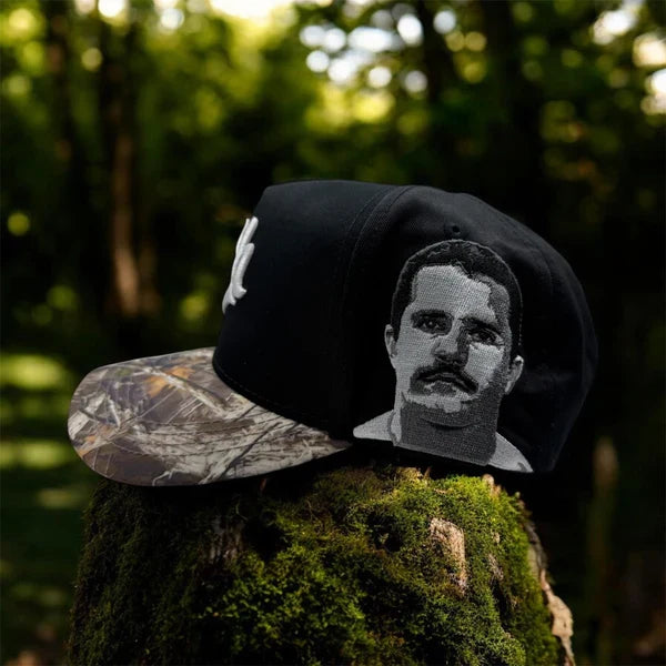 Side profile of Charros de Jalisco Gallo Black/Camo snapback showing detailed embroidered portrait and camouflage brim.