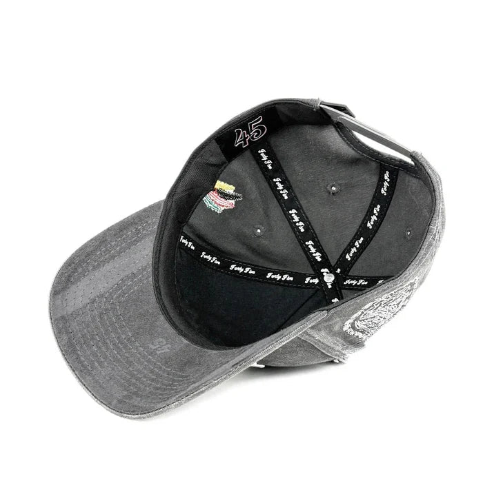 Gray cap with black interior and visible branding on a white background